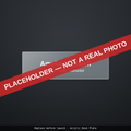 Placeholder illustration: clear acrylic desk plate engraved with a name and title. Not a photograph.